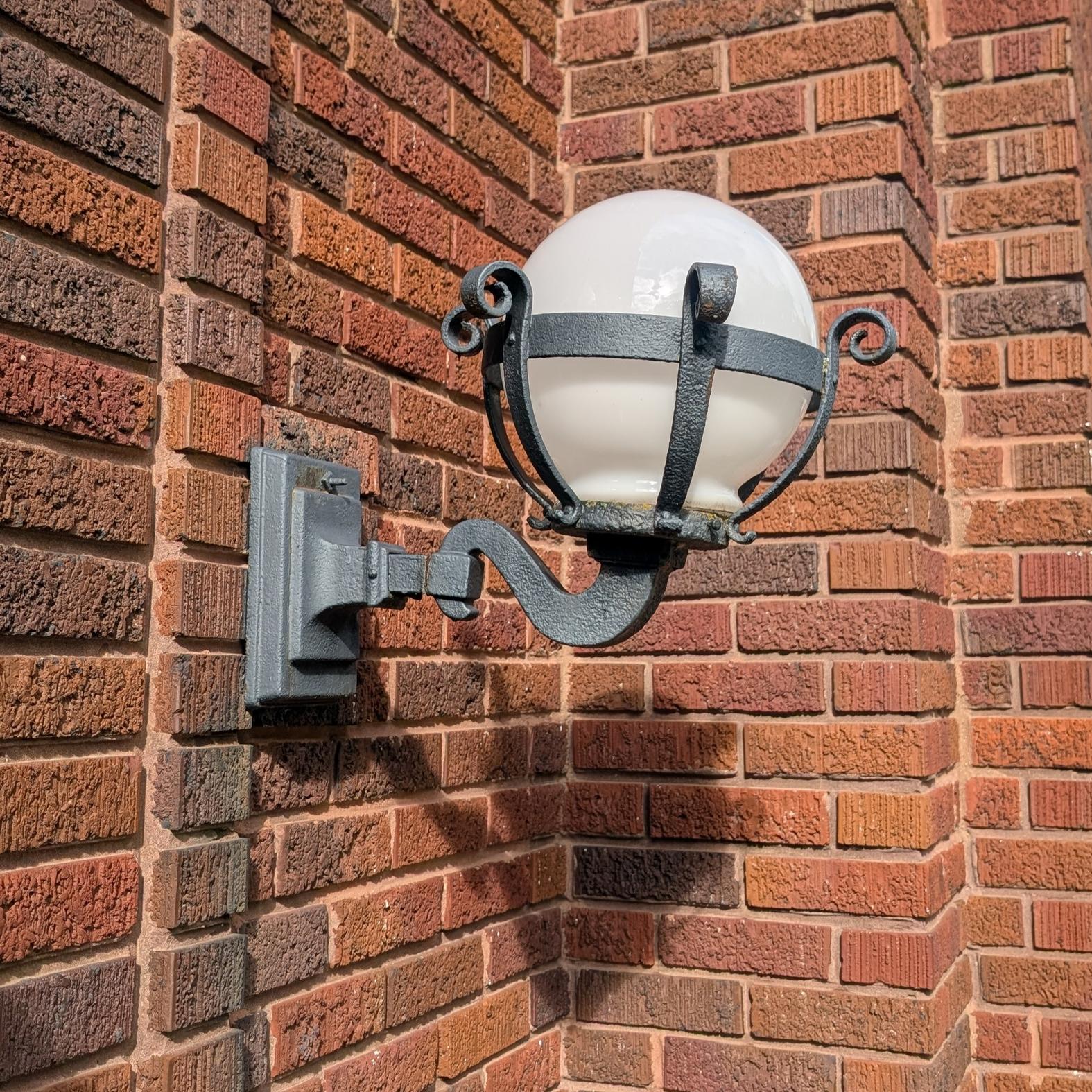 Early 20th Century Globe Municipal Iron Sconce